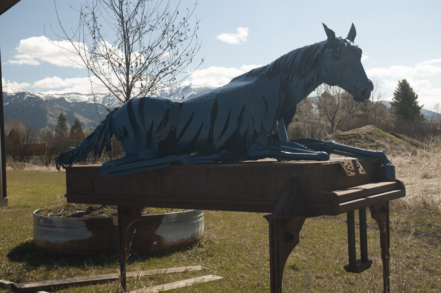 Metal horse sculpture by Jim Dolan on an old piano
